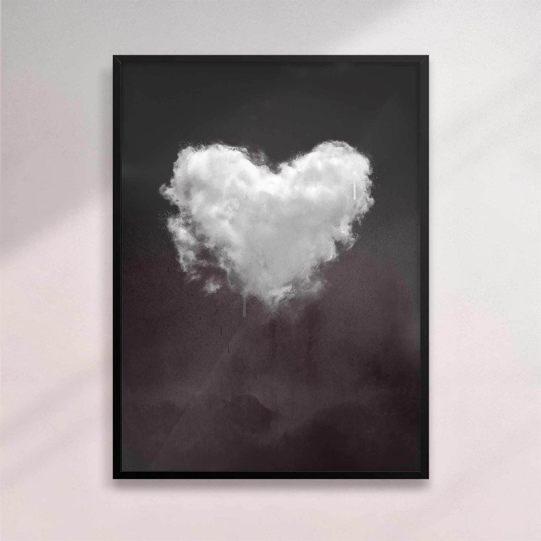 Framed artwork of a heart-shaped cloud on a dark background - black frame