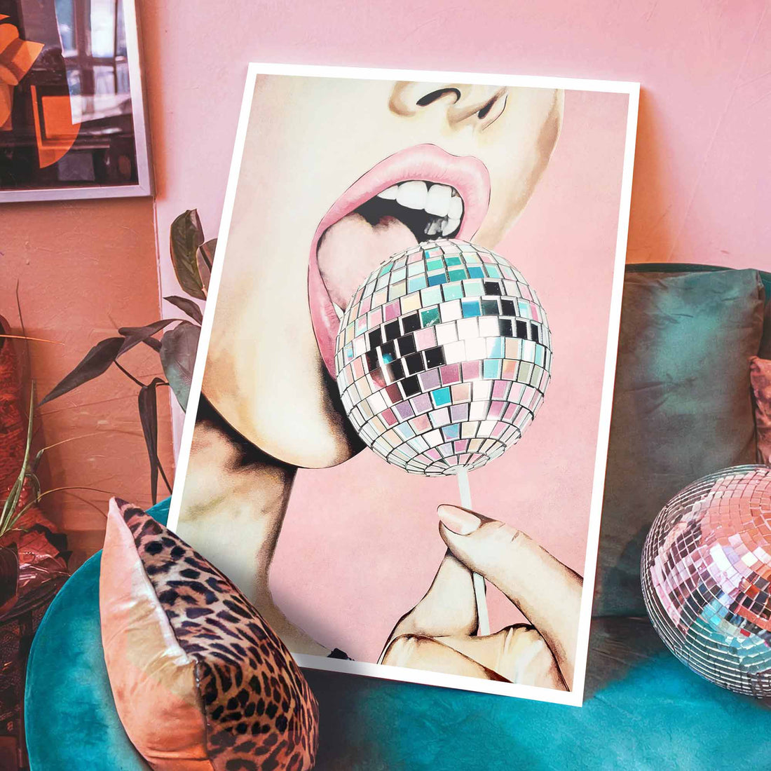 Framed artwork of a person's mouth with a disco ball against a pink black frame background 
