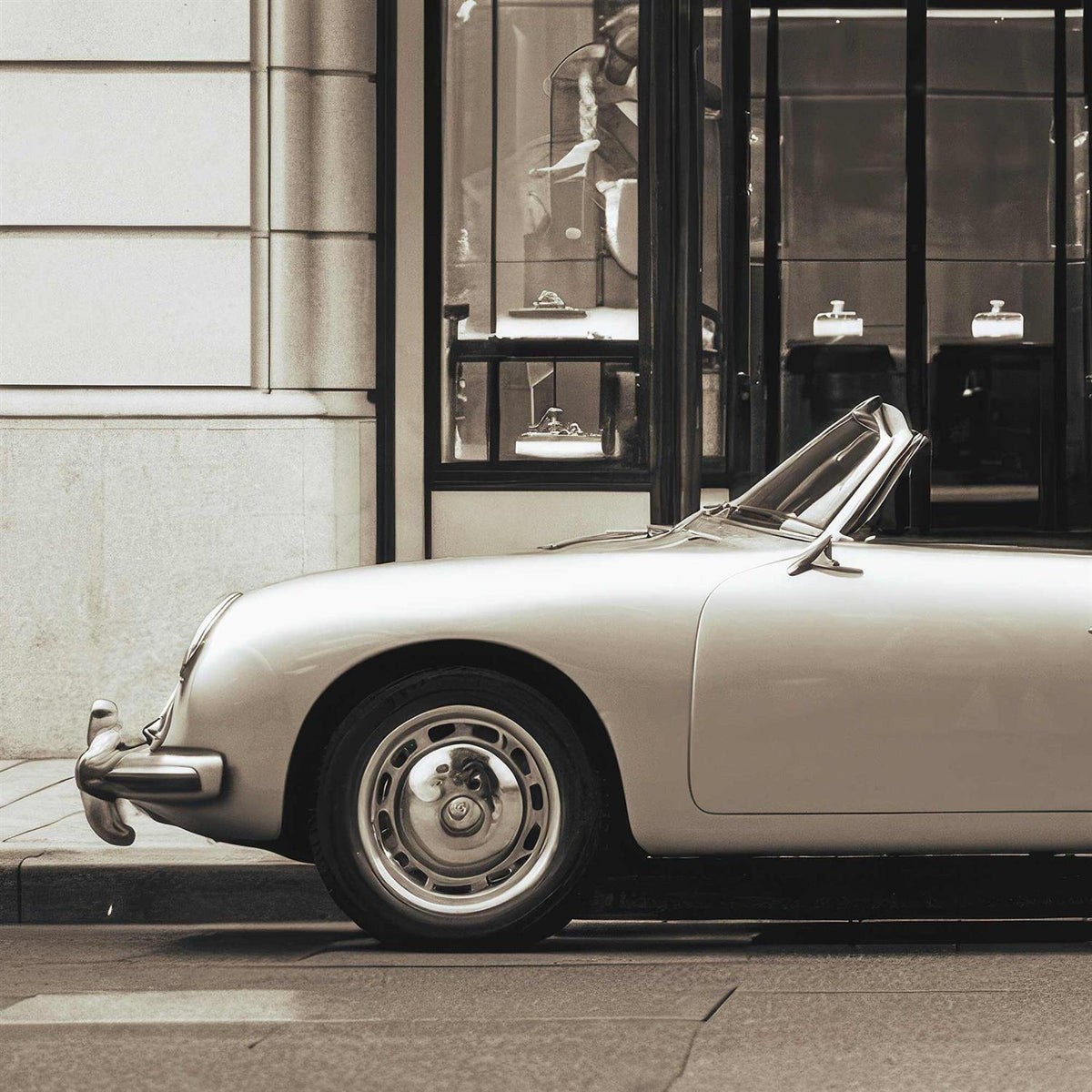 Vintage car parked on a city street with a building in the background