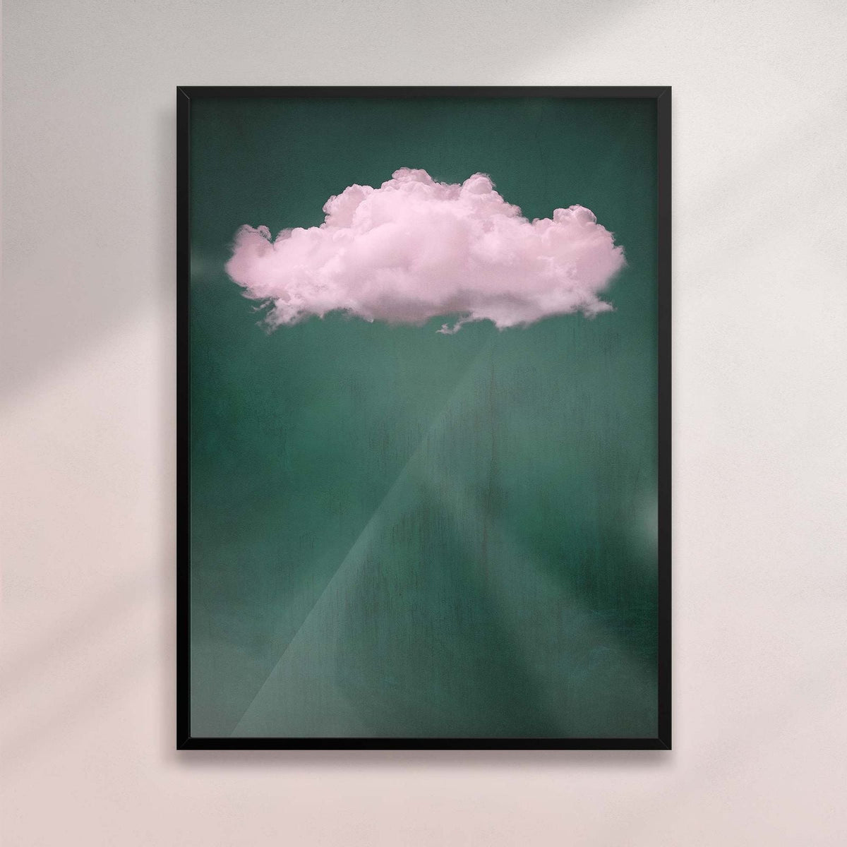 Framed artwork of a cloud on a teal background - Black frame