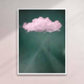 Framed artwork of a pink cloud on a dark green background - white frame