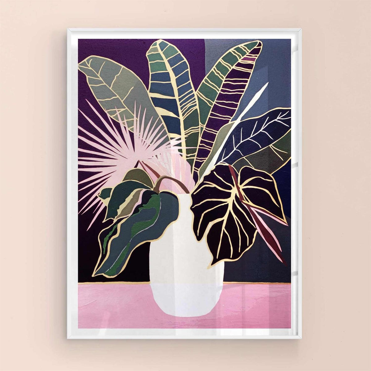 Framed artwork of a vase with colorful leaves on a beige wall with white frame