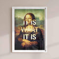Framed artwork of Mona Lisa with 'It is what it is' text on a beige wall with white frame