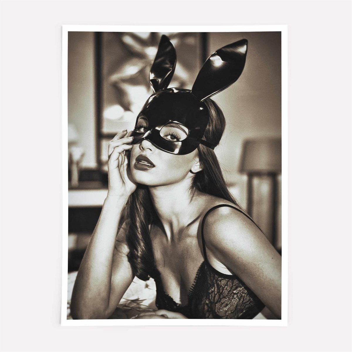 Woman wearing a black leather mask with bunny ears indoors.