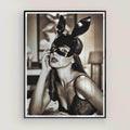 Framed black and white art print of a woman wearing a mask with bunny ears.