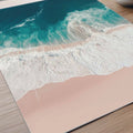 Aerial beach photography print showing turquoise ocean waves washing onto soft sandy shores in a calming coastal scene.